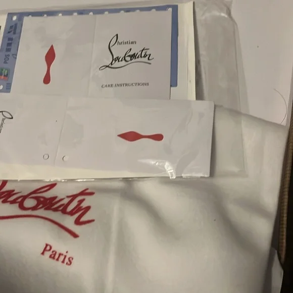 White and black “Christian Louboutin” Louis Flat Calf Spiked. Size 8 1/2.